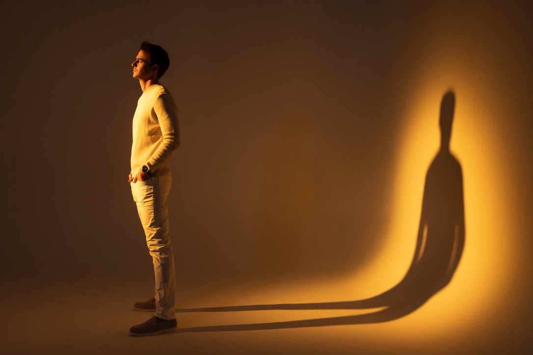 Anthony Kennada on a lit studio set